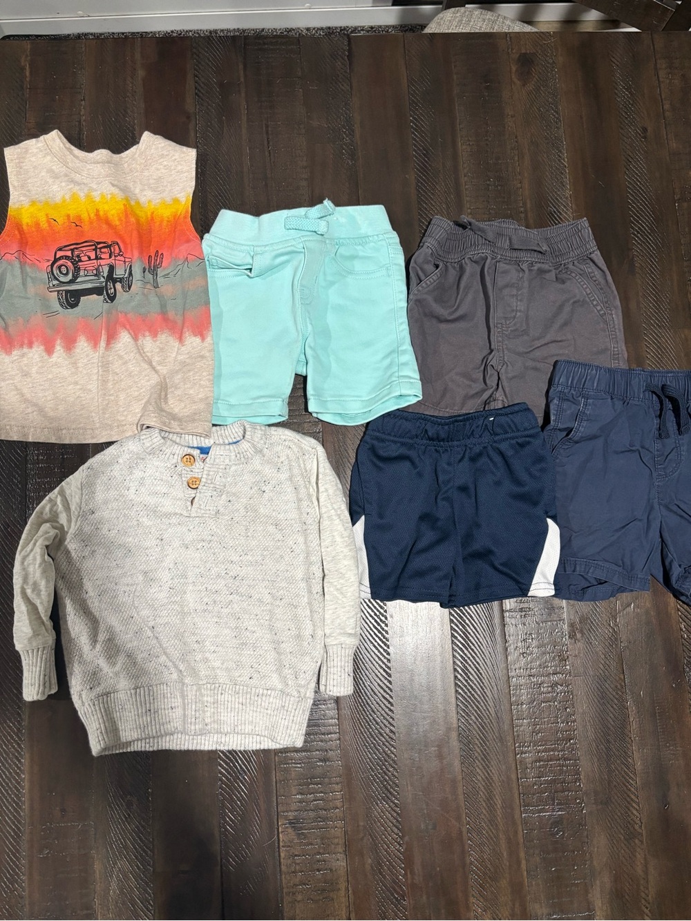 Boy’Lot of clothes-4 shorts, 1 sweater, and one tank top.